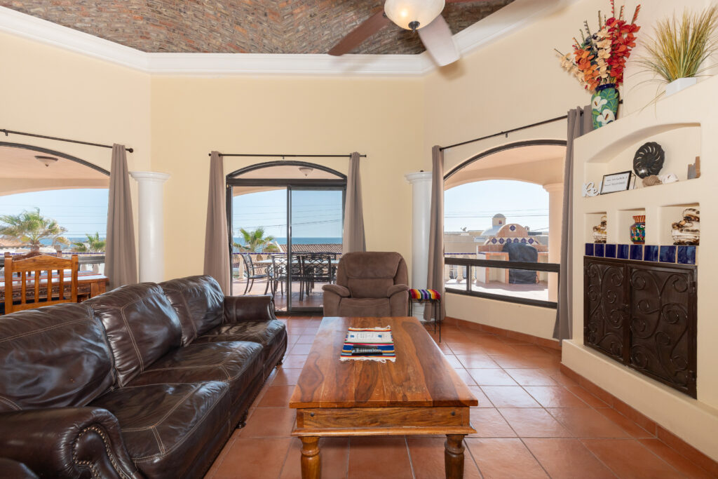 Open living area with boveda ceiling in Las Conchas ¼ share home Rocky Point
